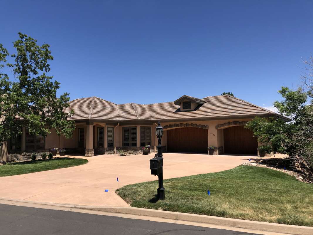 home with ne asphalt shingle roof in Colorado Springs